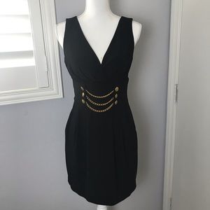 Black size 8 mini dress with chain button detail